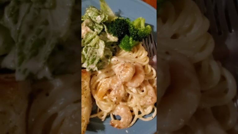 Shrimp Alfredo, broccoli,  Caesar Salad and Garlic Bread.