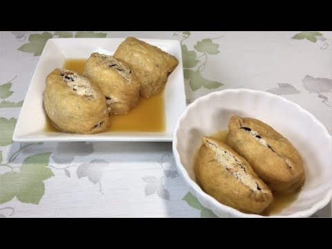 【油揚げとおいなりさんの巾着煮】油揚げとおいなりさんでぷっくりした巾着煮2種類です。食べるとジュワ～と口の中に優しい美味しさが広がります。