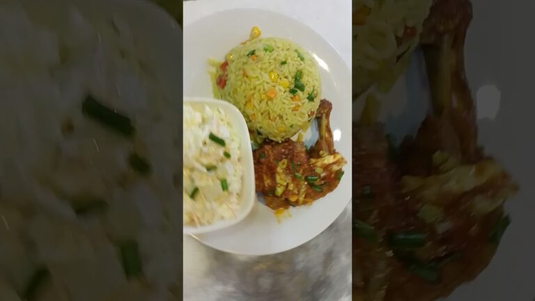 Jollof rice, chicken and coleslaw salad