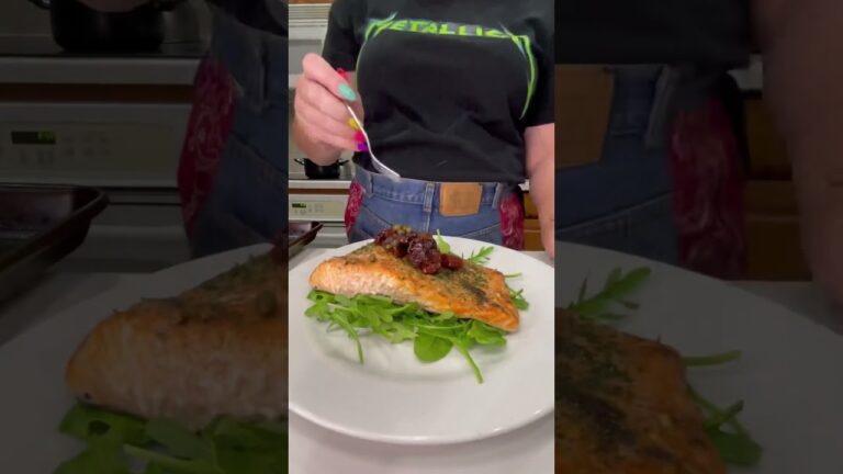 Salmon topped w/ sun-dried tomatoes,capers,& Kalamata olives w/ 🍋cream on baby arugula.#itsanapron