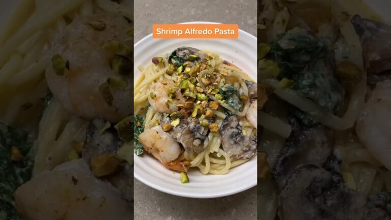 Shrimp, kale, and mushrooms in a creamy Alfredo sauce and topped with crushed pistachios